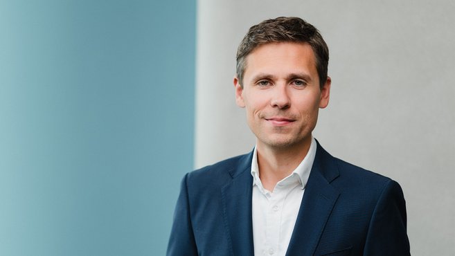 Porträt: Christoph Prusseit – Vorstand der Medios AG lächelt in die Kamera